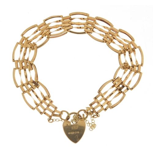 434 - 9ct gold five row gate bracelet with love heart padlock, 16cm in length, 6.6g