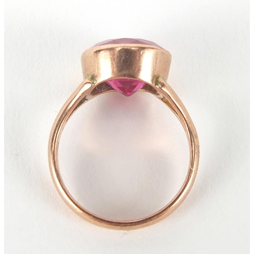 19 - 9ct rose gold ruby solitaire ring, the stone approximately 10mm in diameter, size H, 3.6g
