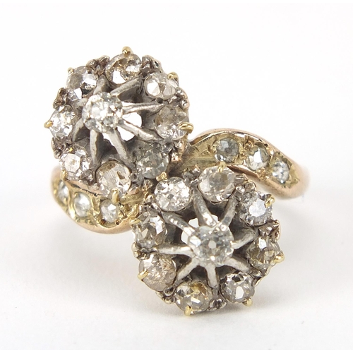 347 - Antique unmarked gold diamond cluster crossover ring, the larger diamonds approximately 2.8mm in dia... 