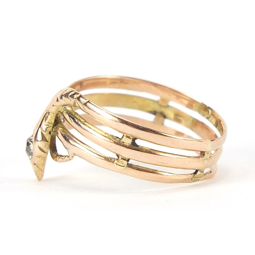 121 - Unmarked gold serpent ring set with a diamond, the diamond approximately 3.0mm in diameter, size T, ... 