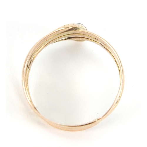 121 - Unmarked gold serpent ring set with a diamond, the diamond approximately 3.0mm in diameter, size T, ... 