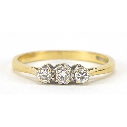 335 - 18ct gold diamond three stone ring, size K, 2.0g