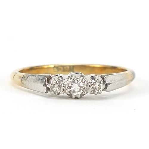 128 - 18ct gold and platinum diamond three stone ring, size O, 2.8g