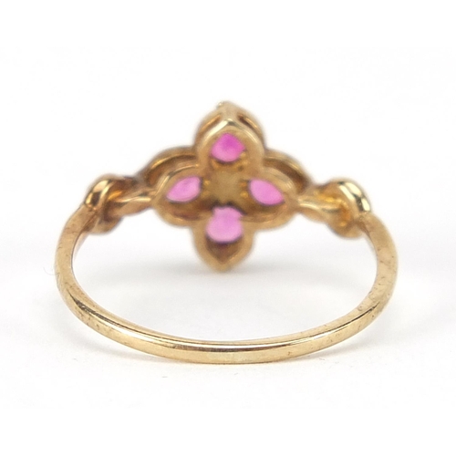 276 - Antique unmarked gold ruby flower head ring, size J, 1.5g