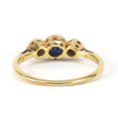 317 - Unmarked gold sapphire and diamond three stone ring, size L, 2.2g