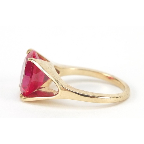 62 - Unmarked gold ruby solitaire ring, the stone approximately 10mm in diameter, size J, 3.6g