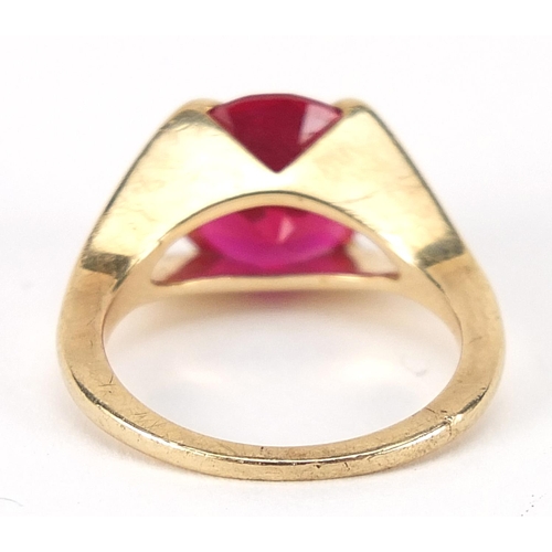 62 - Unmarked gold ruby solitaire ring, the stone approximately 10mm in diameter, size J, 3.6g