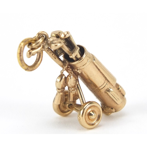 134 - 9ct gold golf club and caddy charm, 3cm high, 6.5g