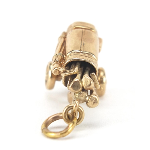 134 - 9ct gold golf club and caddy charm, 3cm high, 6.5g