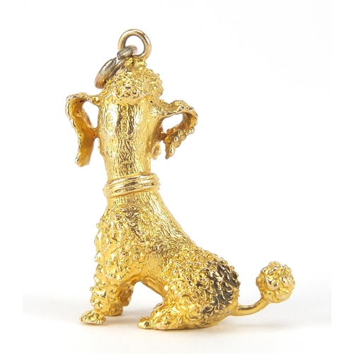 42 - 9ct gold seated poodle charm with ruby eyes, 3cm high, 8.7g