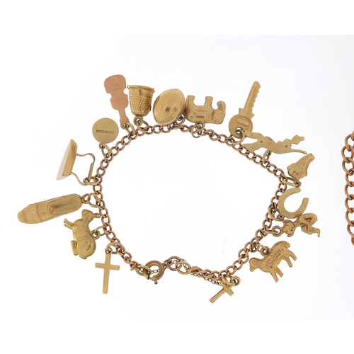 243 - Two 9ct rose gold charm bracelets with a selection of mostly 9ct gold charms including a pixie, rugb... 