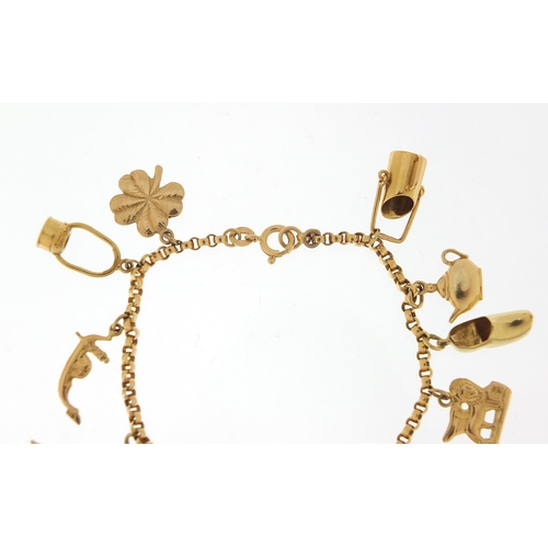 249 - 18ct gold charm bracelet with a selection of 9ct and 18ct gold charms including Eiffel Tower, tortoi... 