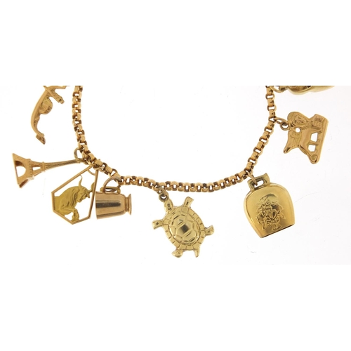 249 - 18ct gold charm bracelet with a selection of 9ct and 18ct gold charms including Eiffel Tower, tortoi... 