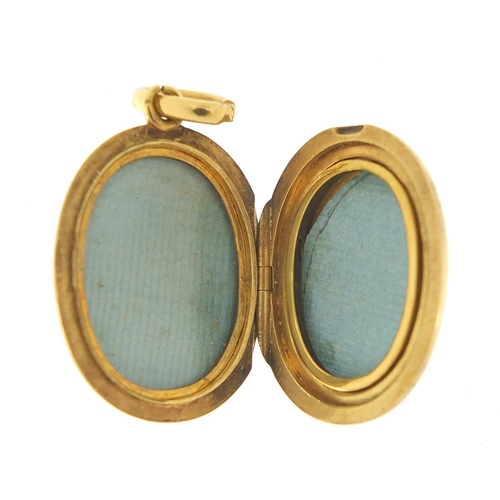 230 - 18ct gold oval locket, 3.5cm high, 8.2g