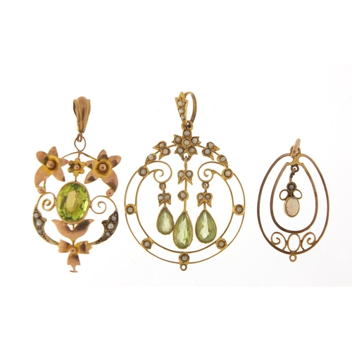 153 - Three Art Nouveau gold pendants set with peridot, seed pearls and opal, the largest 4.4cm high, tota... 