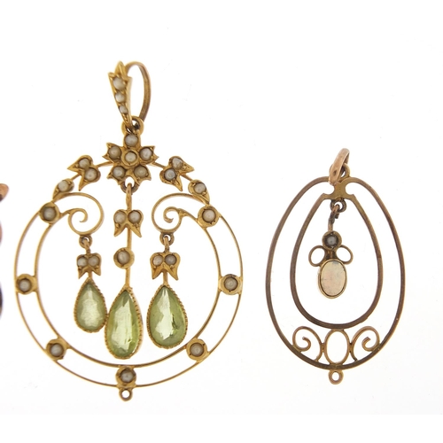 153 - Three Art Nouveau gold pendants set with peridot, seed pearls and opal, the largest 4.4cm high, tota... 