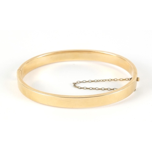 227 - 15ct gold hinged bangle, 6.5cm wide, 10.0g