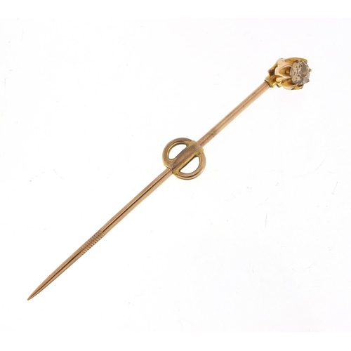 137 - Unmarked gold diamond solitaire stick pin, the diamond approximately 3.5mm in diameter, 6cm in lengt... 