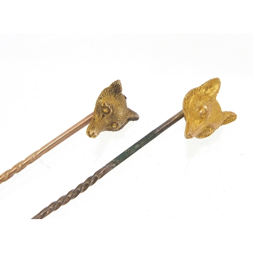 222 - Two Victorian unmarked gold fox head stick pins, the largest 6cm in length, total 3.0g