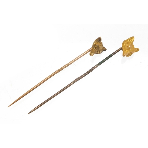 222 - Two Victorian unmarked gold fox head stick pins, the largest 6cm in length, total 3.0g