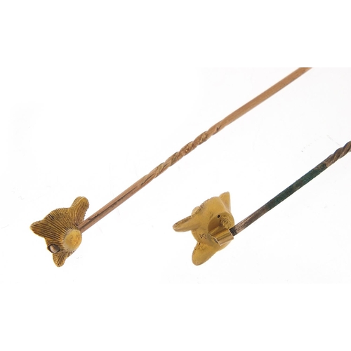 222 - Two Victorian unmarked gold fox head stick pins, the largest 6cm in length, total 3.0g