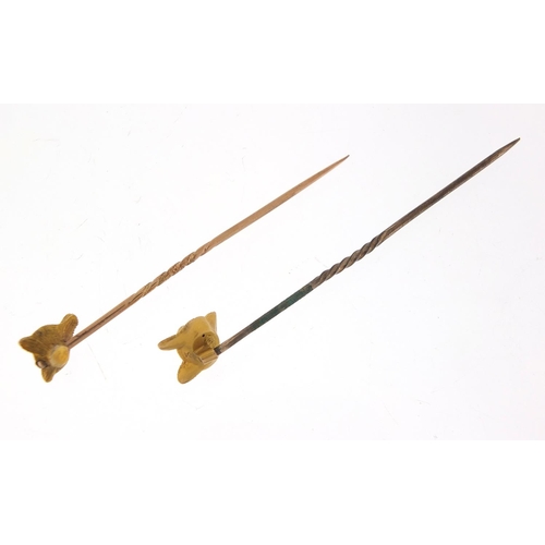 222 - Two Victorian unmarked gold fox head stick pins, the largest 6cm in length, total 3.0g