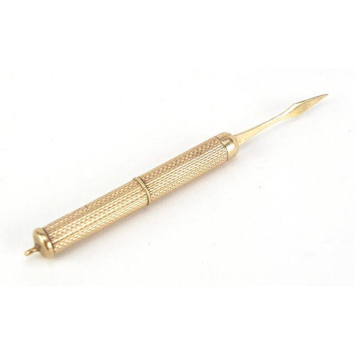 674 - 9ct gold engine turned propelling toothpick by Cohen & Charles, Birmingham 1991, 7.6cm in length whe... 