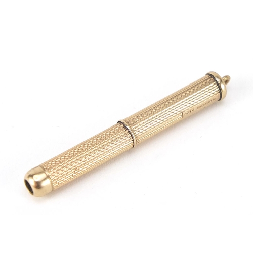 674 - 9ct gold engine turned propelling toothpick by Cohen & Charles, Birmingham 1991, 7.6cm in length whe... 