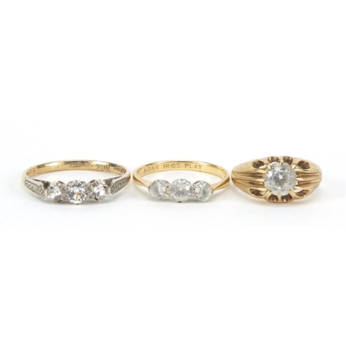 338 - Three 18ct gold and 9ct gold clear stone rings, sizes F, L and O, 6.0g