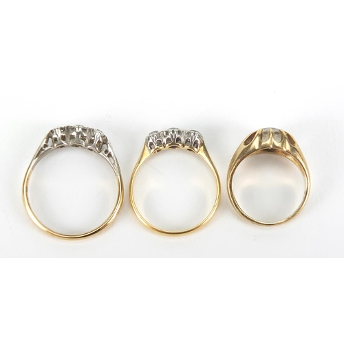 338 - Three 18ct gold and 9ct gold clear stone rings, sizes F, L and O, 6.0g