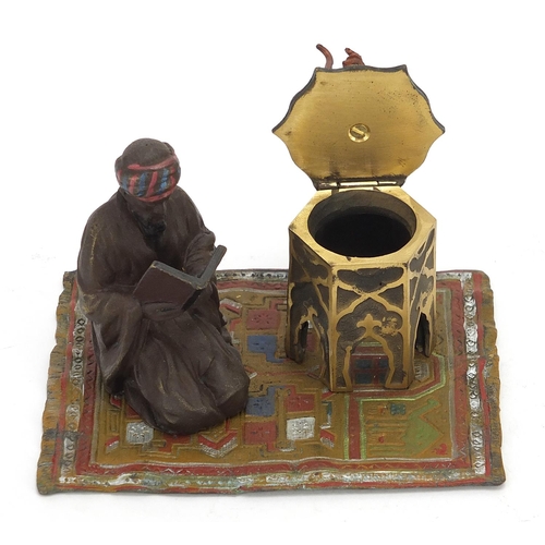 2455 - Cold painted bronze figure of an Arab on a carpet in the style of Franz Xaver Bergmann, 14cm wide