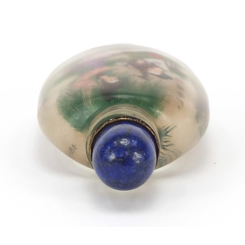 2436 - Chinese glass snuff bottle with hardstone stopper, internally hand painted with females, 10.5cm high