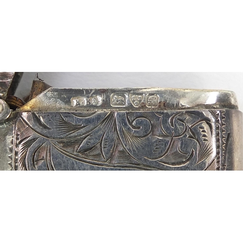 697 - Three Victorian silver vestas with engine turned and engraved decoration, Birmingham hallmarks, the ... 