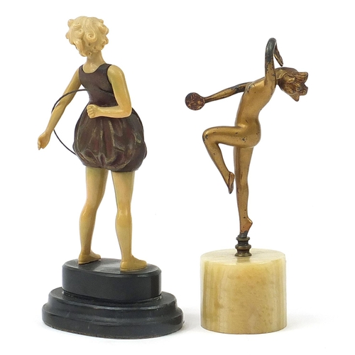 908 - Art Deco design gilt spelter figurine of a dancing nude discus girl and an example of a Hula girl, t... 