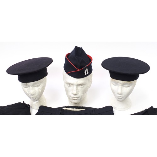 3506 - Three vintage Fireman's uniforms and two hats, one with remnants of paper label