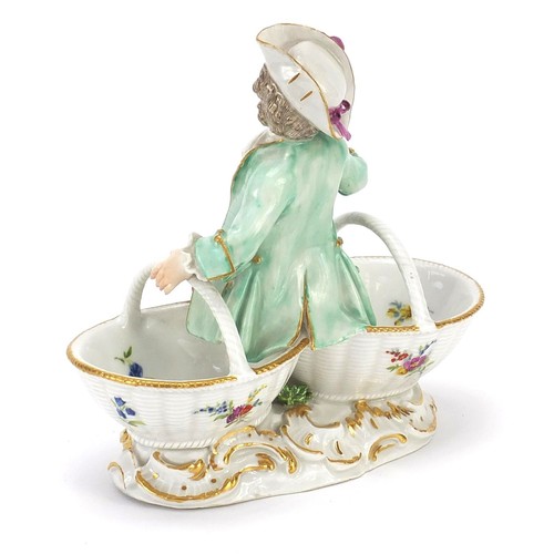 688 - Meissen, 19th century German porcelain figural sweetmeat dish of a young boy hand painted with flowe... 