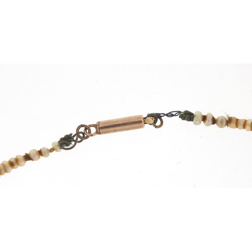 51 - Antique graduated pearl necklace with 9ct gold clasp, housed in a tooled leather box, 42cm in length