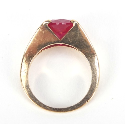 62 - Unmarked gold ruby solitaire ring, the stone approximately 10mm in diameter, size J, 3.6g