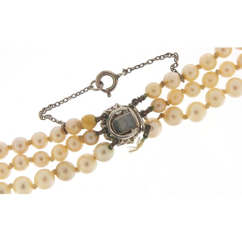 198 - Three row graduated pearl necklace with diamond clasp, the largest pearl approximately 8mm in diamet... 