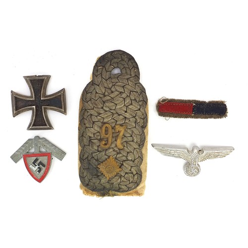 3477 - German militaria including an epaulet, Iron Cross and eagle cap badge, the largest 11.5cm in length