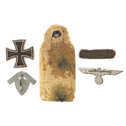 3477 - German militaria including an epaulet, Iron Cross and eagle cap badge, the largest 11.5cm in length