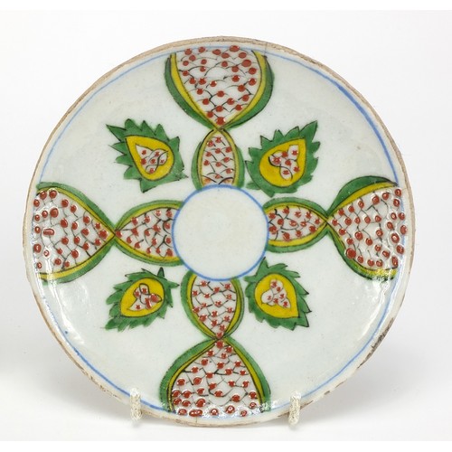 539 - Two Turkish Kutahya pottery plates hand painted with flowers, each 14.5cm in diameter