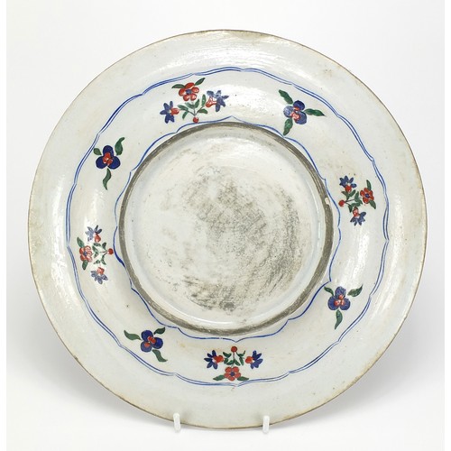 540 - Turkish Iznik pottery plate hand painted with flowers, 31cm in diameter