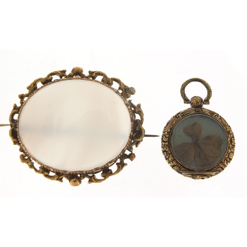 114 - Two antique Scottish agate brooches with gold coloured metal mounts and a Victorian locket with four... 