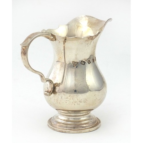 779 - Garrard & Co Ltd, silver cream jug London 1977, 9cm high, 148.2g