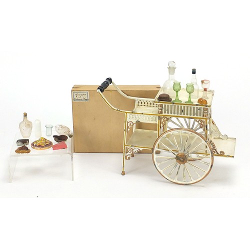1083 - 19th century German tinplate refreshment wagon with implements housed in a cardboard case including ... 