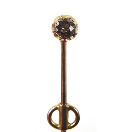 137 - Unmarked gold diamond solitaire stick pin, the diamond approximately 3.5mm in diameter, 6cm in lengt... 