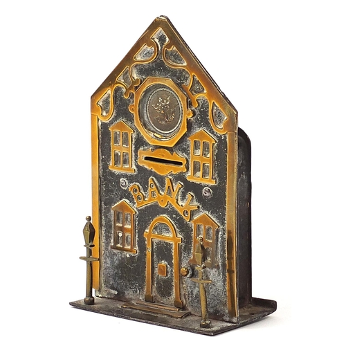 291 - 19th century brass money bank in the form of a building with two lanterns to the exterior, 18cm high