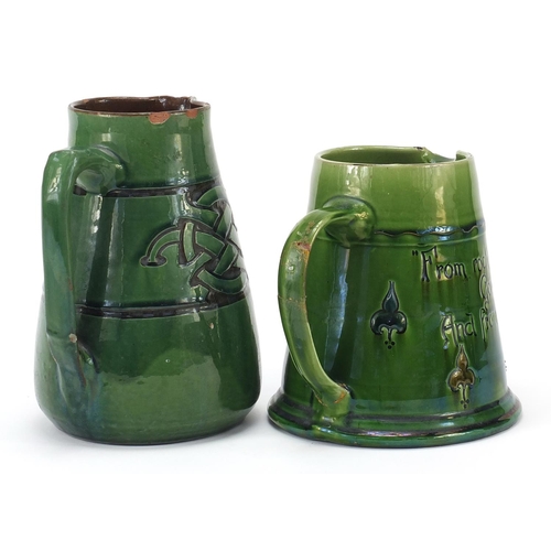 379 - C H Branham, two green glazed jugs made for Liberty & Co, the largest 19cm high