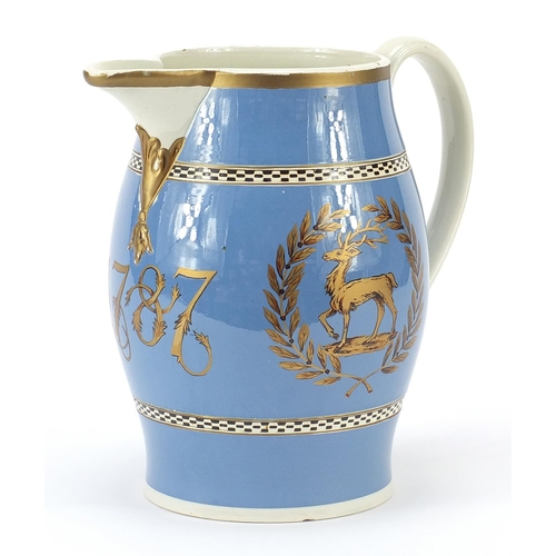 346 - 18th century creamware jug gilded with armorial stag and bow, dated 1787, 22cm high